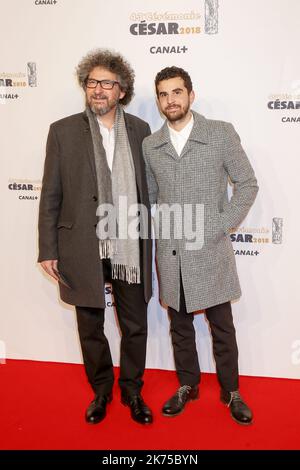 Radu Mihaileanu and a guest arrive at the Cesar Film Awards 2018 at Salle Pleyel on March 2, 2018 in Paris, France. 02.03.2018 Stock Photo