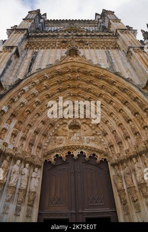 Carved architectural and motif details on the entrance door at the Santa Maria da Vitoria Monastery, Batalha, Portugal. Stock Photo