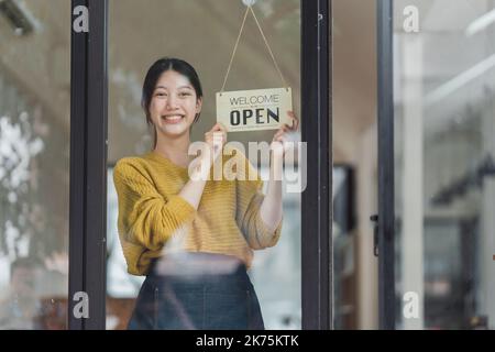 Portrait of Startup successful small business owner in coffee shop. SME entrepreneur seller business concept Stock Photo
