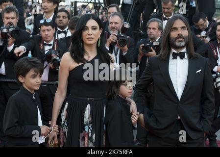 (From L) Lebanese producer Khaled Mouzanar, Syrian actor Zain al-Rafeea and Lebanese director and actress Nadine Labaki and gher son Walid arrive on May 19, 2018 for the closing ceremony and the screening of the film 'The Man Who Killed Don Quixote' at the 71st edition of the Cannes Film Festival in Cannes, southern France.  Stock Photo