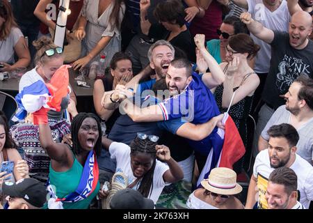 Christophe Morin / IP3 . French supporters look in a bar, the final of the 2018 Football World Cup between France and Croatia, in Paris, France, on July 15th, 2018. Stock Photo