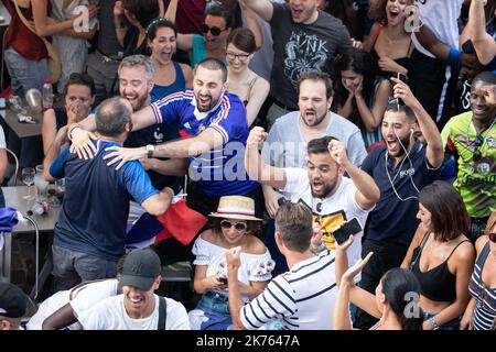 Christophe Morin / IP3 . French supporters look in a bar, the final of the 2018 Football World Cup between France and Croatia, in Paris, France, on July 15th, 2018. Stock Photo