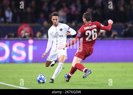 Paris Saint-Germain's Thilo Kehrer (left) and Liverpool's Andrew Robertson battle for the ball Stock Photo