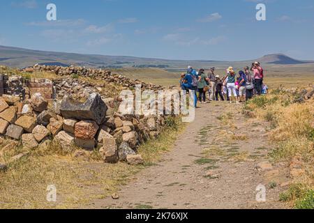 ANI, TURKEY - JULY 18, 2019: Tourists visit ruins of the ancient city Ani, Turkey Stock Photo