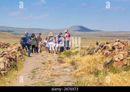 ANI, TURKEY - JULY 18, 2019: Tourists visit ruins of the ancient city Ani, Turkey Stock Photo