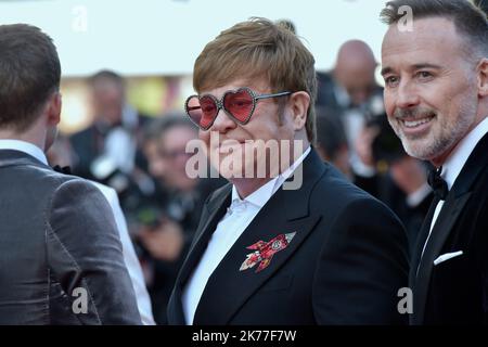 Elton John and husband David Furnish  attends the screening of Rocket Man during the 72nd annual Cannes Film Festival on May 16, 2019 in Cannes, France. Stock Photo