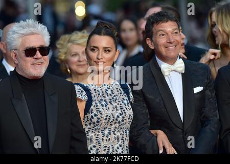 Pedro Almodovar, Penelope Cruz, wearing Atelier Swarovski Fine Jewelry and Antonio Banderas leave the screening of 'Pain And Glory Dolor Y Gloria/Douleur Et Gloire during the 72nd annual Cannes Film Festival on May 17, 2019 in Cannes, France. Stock Photo