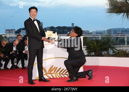 Director Bong Joon-Ho, winner of the Palme d'Or award for his film Parasite poses at the winner photocall during the 72nd annual Cannes Film Festival on May 25, 2019 in Cannes, France Stock Photo