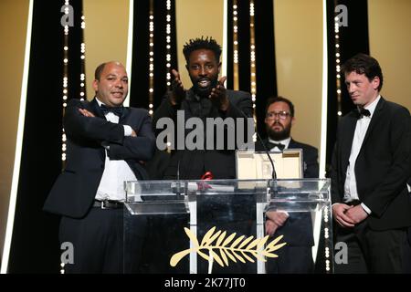 French director Ladi Ly on stage after winning the Jury Prize ex-aequo for his movie 'Les Miserables' during the Award Winners photocall at the 72nd annual Cannes Film Festival, in Cannes, France, 25 May 2019. Stock Photo