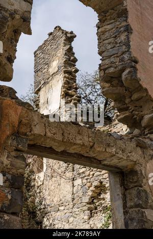 stone built walls and ruined buildings in an abandoned Spanish Pyrenees village Stock Photo