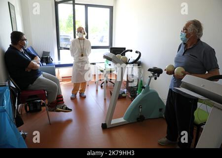 Pavilion of the Center for follow-up care and rehabilitation of the ChÃ¢teauroux hospital, post Covid-19 unit, coronavirus. Physiotherapy and respiratory rehabilitation session with patients healed from Covid-19. Stock Photo