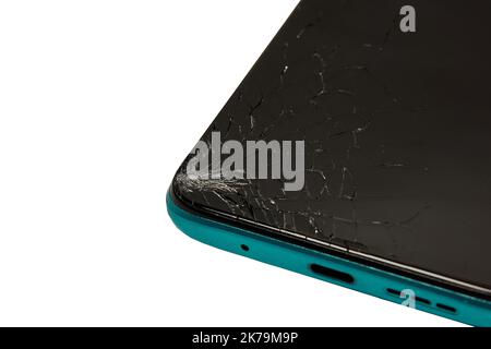 Damaged cell phone screen after a fall, cracked smartphone screen glass. Stock Photo