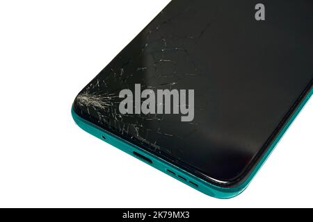 Damaged cell phone screen after a fall, cracked smartphone screen glass. Stock Photo