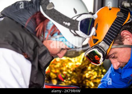 Mountain emergency response team. Among its missions, the French national police provide mountain rescue with the support of civil security helicopter pilots and SAMU doctors, notably in Isere on the Alpe d'Huez Altiport - Henri Giraud ( LFHU) Stock Photo