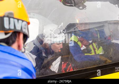 Mountain emergency response team. Among its missions, the French national police provide mountain rescue with the support of civil security helicopter pilots and SAMU doctors, notably in Isere on the Alpe d'Huez Altiport - Henri Giraud ( LFHU) Stock Photo