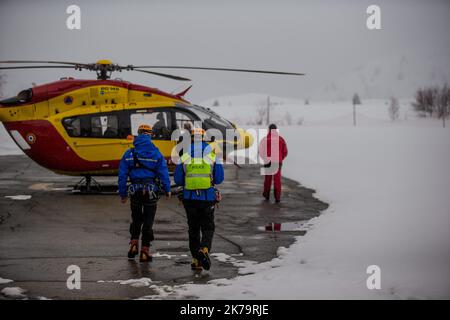 Mountain emergency response team. Among its missions, the French national police provide mountain rescue with the support of civil security helicopter pilots and SAMU doctors, notably in Isere on the Alpe d'Huez Altiport - Henri Giraud ( LFHU) Stock Photo