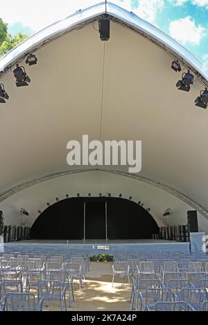 Outdoor concert hall with rows of empty chairs Stock Photo