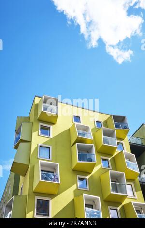 Copenhagen, Denmark - Sept 2022:  Modern green yellow cube buildings, Orestad district designed by JJW Arkitekter Ørestad Plejecenter, Senior Housing Stock Photo