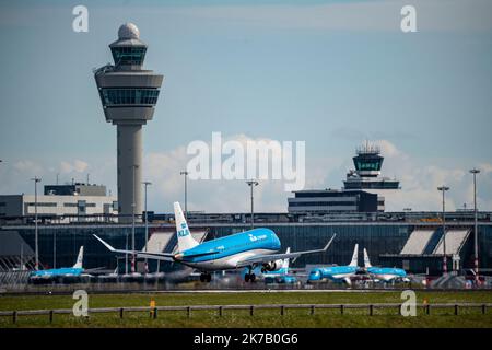 Amsterdam Schiphol Airport, AMS, aircraft approaching Kaagbaan, runway, terminal building, air traffic control tower, KLM Cityhopper, Stock Photo