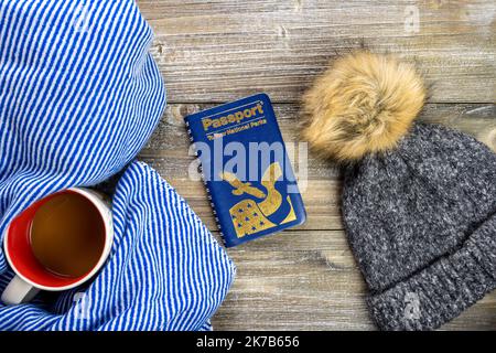 New Hope, Minnesota - October 6, 2022: Flatlay travel vacation concept to the US National Parks, for winter trips. National Park passport book, hat, c Stock Photo