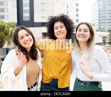 Positive multiracial young fashionable women in summer outfits