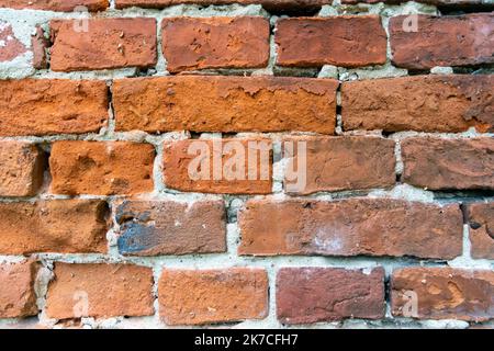 red wall made of brick - background Stock Photo