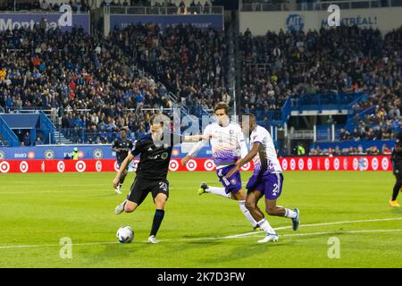 Montreal, Canada. 16th Oct, 2022. CF Montreal midfielder Lassi Lappalainen (21) shoots as Orlando City defender Ruan (2) defends during the Audi 2022 MLS Cup Playoffs match between Orlando City SC and CF Montreal held at Saputo Stadium in Montreal, Canada. Daniel Lea/CSM/Alamy Live News Stock Photo