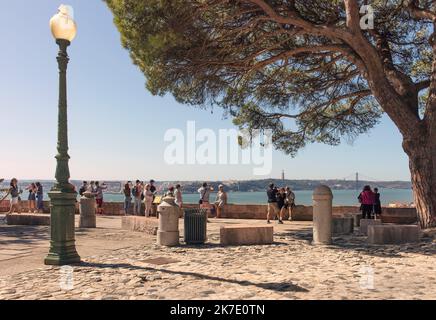 People looking at the view of the River Tagus, Lisbon, Portugal from Castelo Sao Jorge Stock Photo