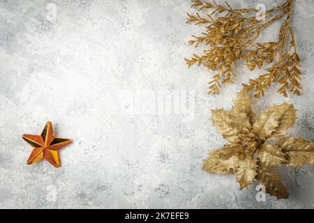 christmas background with golden leaves and branches and a star on white background Stock Photo