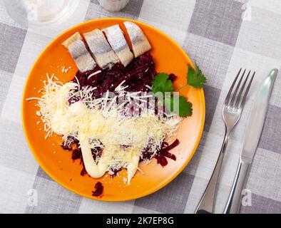 Beetroot served with cheese and pickled mackerel Stock Photo