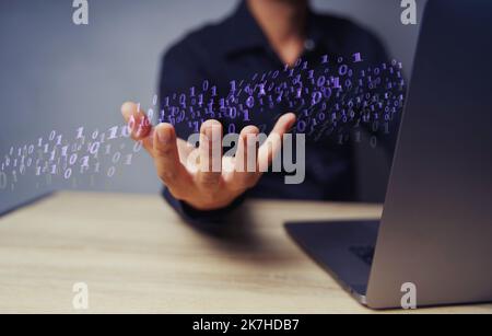 Zero One background in the hands of developers is a global representation of binaries, networks, and coding of programming fundamentals concepts. Stock Photo