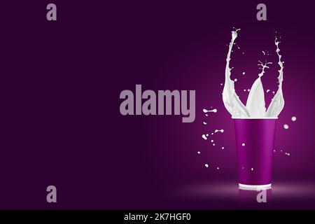 Paper cups with milk splashes on colorful background. Disposable cup with white milk splashes. Stock Photo