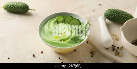 Bowl with cold cucumber soup gazpacho on light background Stock Photo