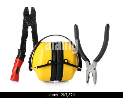 Hearing protectors with pliers on white background Stock Photo