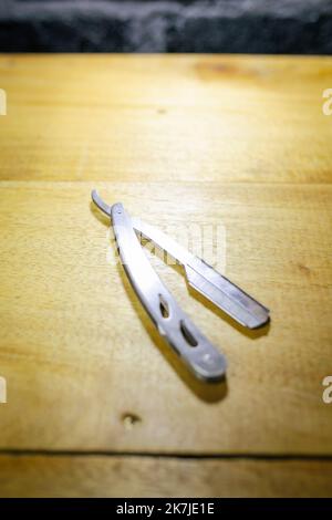 Unsafe Razorblade Open old dangerous razor on a wooden background. isolated, blade Stock ...