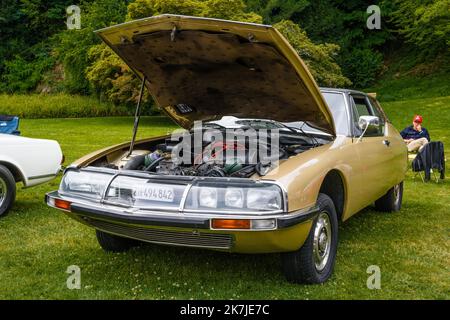 BADEN BADEN, GERMANY - JULY 2019: yellow sand beige CITROEN SM 1970 1975 with opened hood, oldtimer meeting in Kurpark. Stock Photo