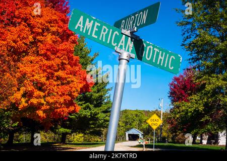 Street sign at Grant Wood's American Gothic House, Eldon, Iowa; bright fall colors, blue sky, October day Stock Photo