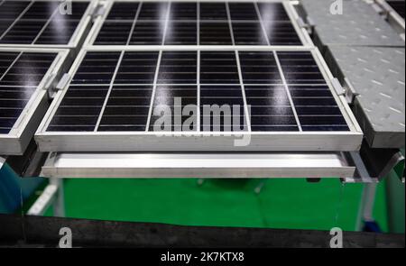 Close-up of Photovoltaic panel system installation with rain gutter. Solar cell panel. Stock Photo