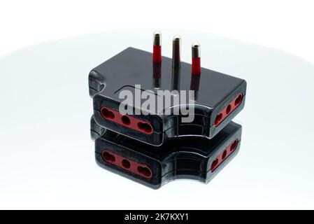 Electrical socket adaptor. Connecting devices to home power isolated on white Stock Photo