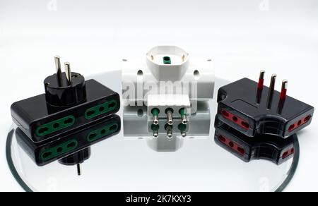Electrical socket adaptors. Connecting devices to home power isolated on white Stock Photo