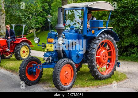 BADEN BADEN, GERMANY - JULY 2019: blue red LANZ BULLDOG retro tractor 1921 1960, oldtimer meeting in Kurpark. Stock Photo