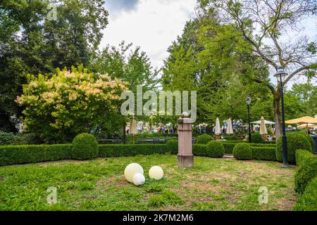 Green trees and bushes in the park, oldtimer meeting in Kurpark. Stock Photo