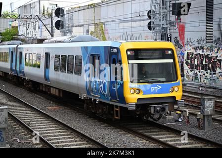 Frankston bound X'Trapolis 100 train, featuring current PTV and Metro logos, in Melbourne's inner suburbs Stock Photo