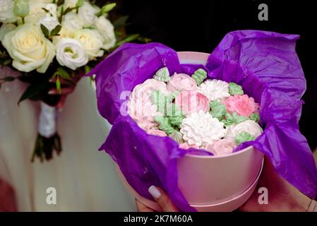 Wedding bouquet made of white roses wedding bouquet of the bride on the lawn or table Stock Photo