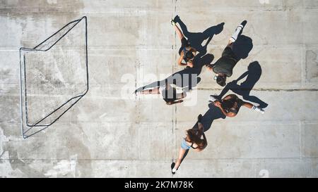 Top view, soccer team and stretching for fitness, workout or game 