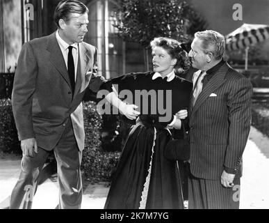 WILLIAM CHING KATHARINE HEPBURN and SPENCER TRACY in PAT AND MIKE 1952 director GEORGE CUKOR writers Ruth Gordon and Garson Kanin producer Lawrence Weingarten Metro Goldwyn Mayer Stock Photo