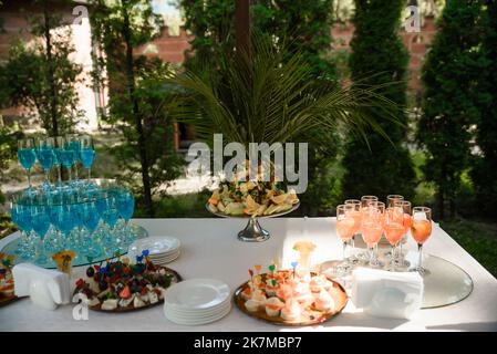 Decorated plate with fork and spoon. Table set up in boho style with pampas grass and greenery Stock Photo
