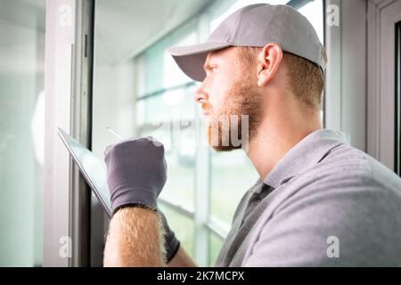 male glazier using a tablet Stock Photo