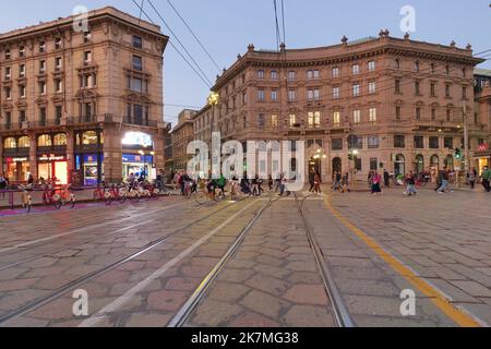 Cordusio square with surrounding palaces, houses and buildings at sunrise in Italian capital of fashion and luxury Stock Photo