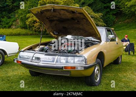 BADEN BADEN, GERMANY - JULY 2019: yellow sand beige CITROEN SM 1970 1975 with opened hood, oldtimer meeting in Kurpark. Stock Photo